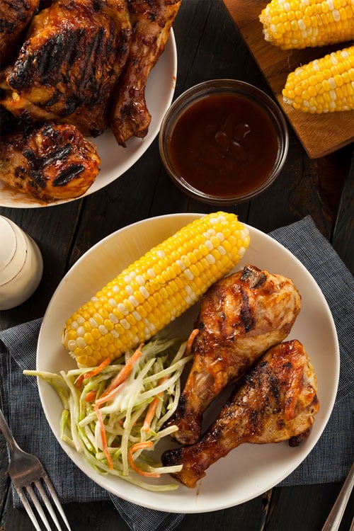 Air fryer BBQ chicken legs, recipe bite-shot, with corn and salad on the side