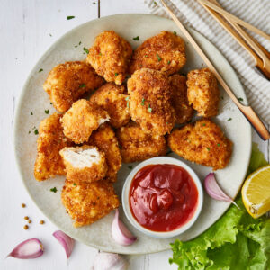 air fried chick-fil-a nuggets, served on a white plate