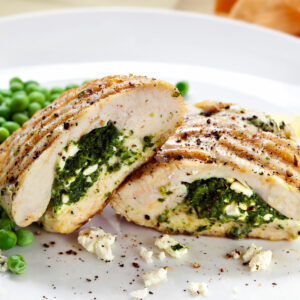stuffed chicken breast in air fryer with green peas on the side
