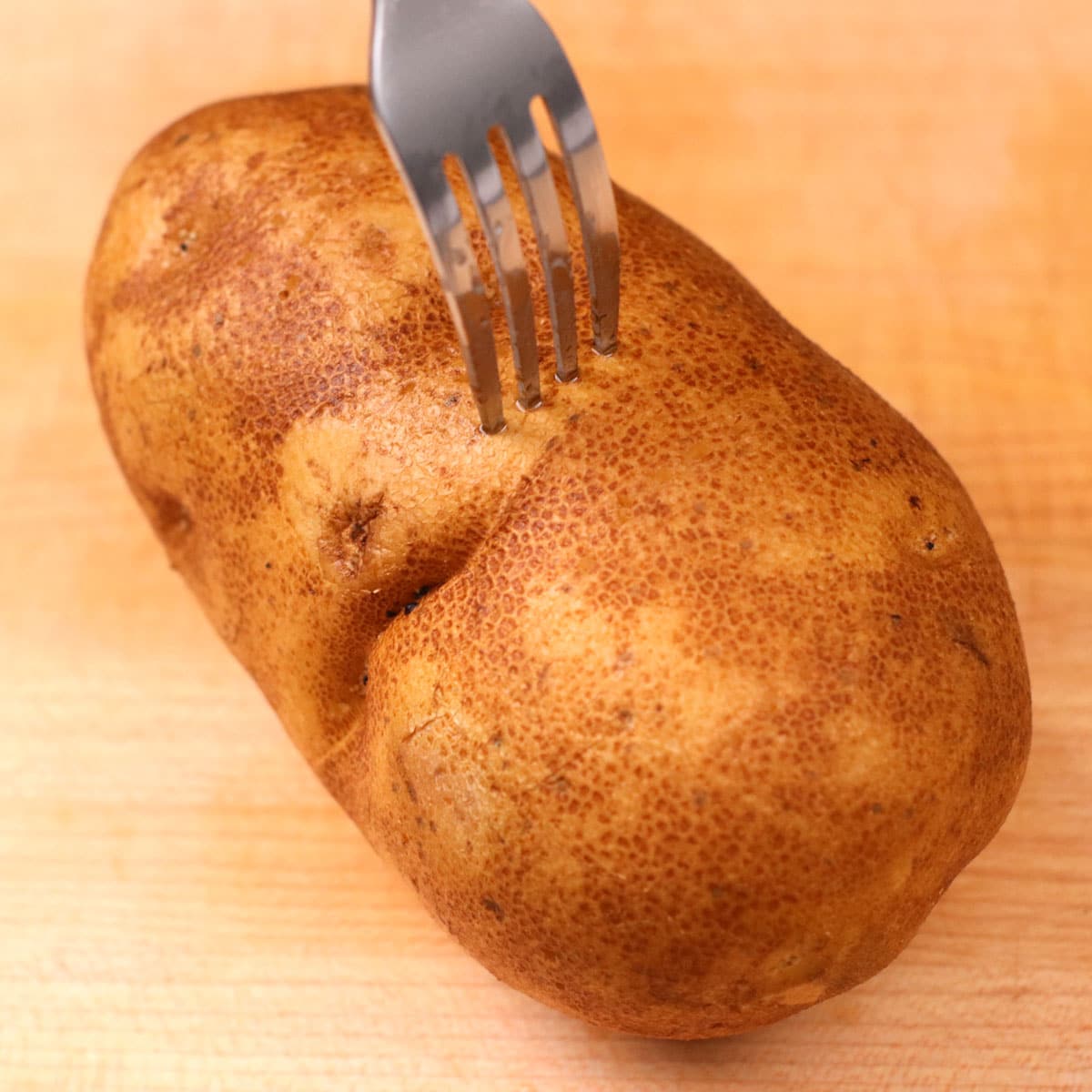 Poking potato with a fork