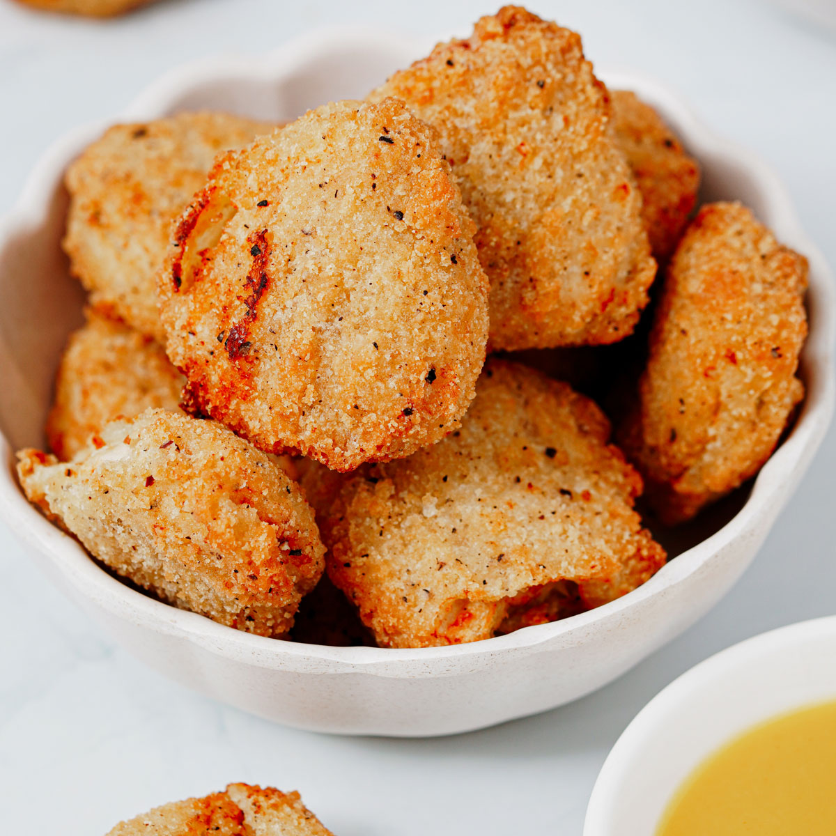 Air fried frozen chicken nuggets in a small bowl