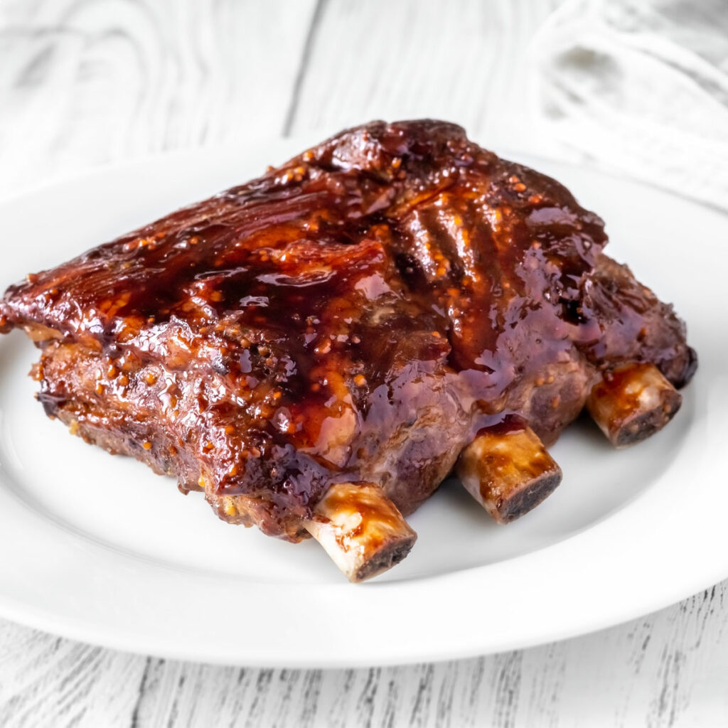 air fried spare ribs, served on a white plate
