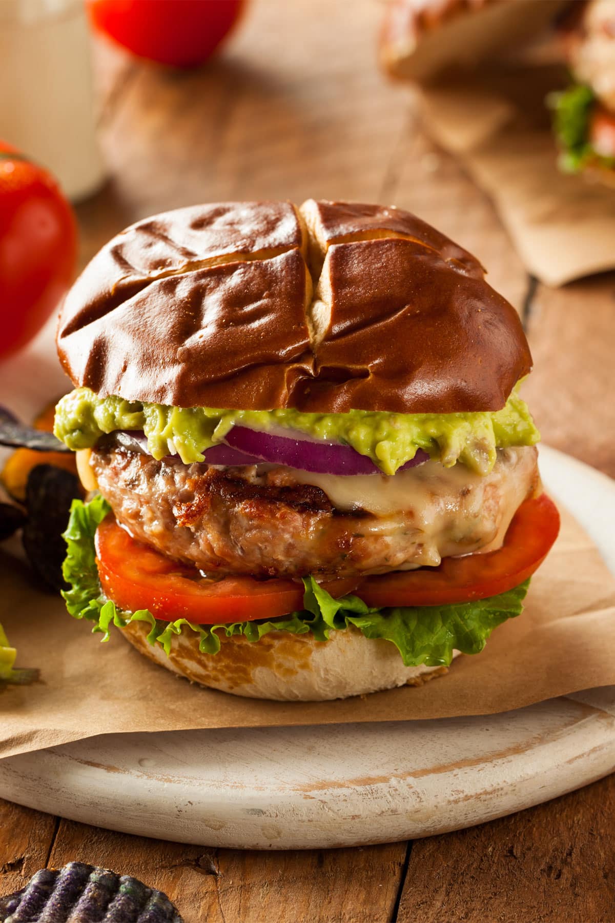 air fryer turkey burgers, recipe bite-shot, with lettuce, tomato, cheese, onion, avocado