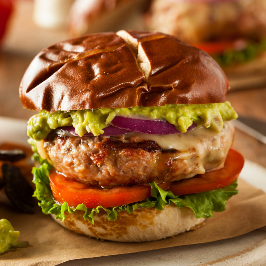 air fried turkey burgers, with lettuce, tomato, cheese, onion, avocado