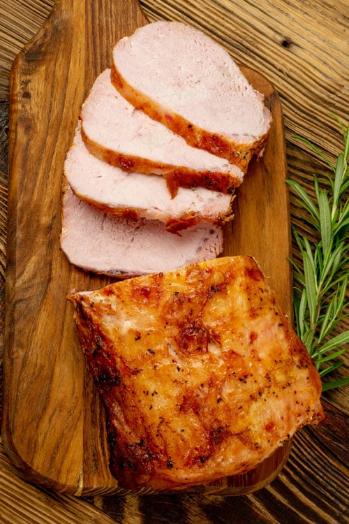 air fryer marinated pork tenderloin, recipe bite-shot, served on a board