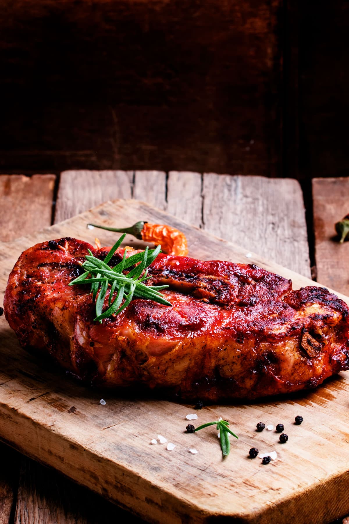 air fryer pork shoulder steak, recipe bite-shot, served on a chopping board