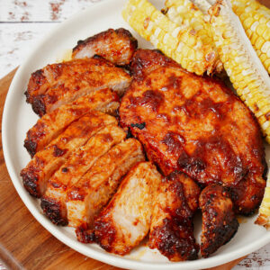 Air fried boneless pork chops with roasted corn ribs, close-up shot