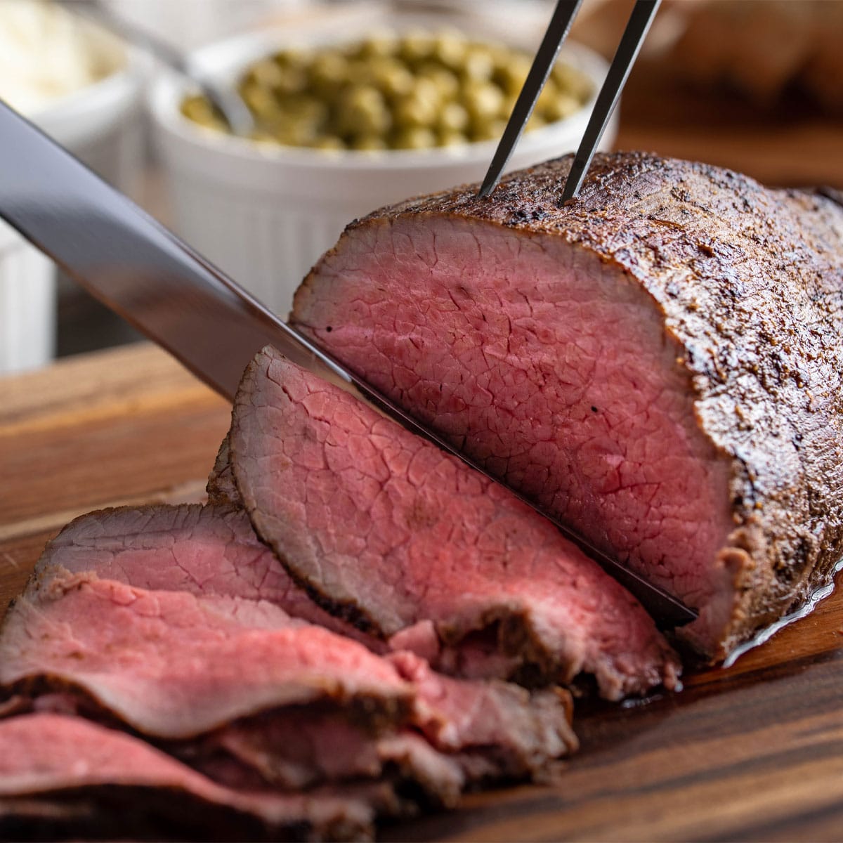Air fried roast beef served on a chopping board.